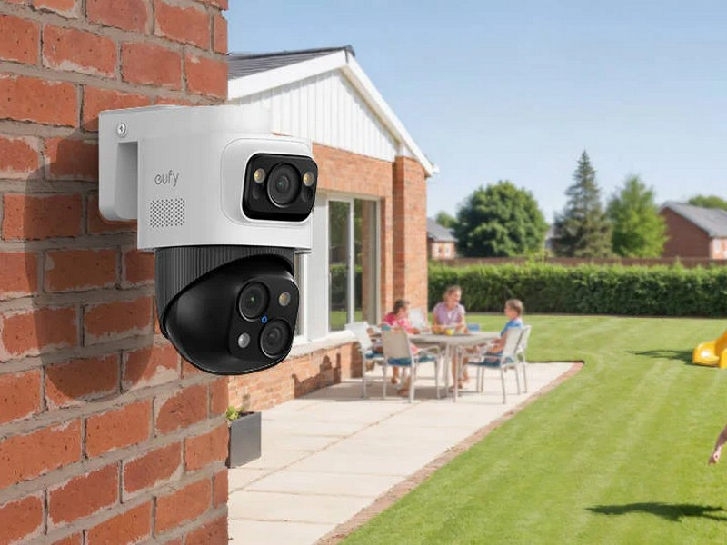 Outdoor home security camera monitoring a garden entrance